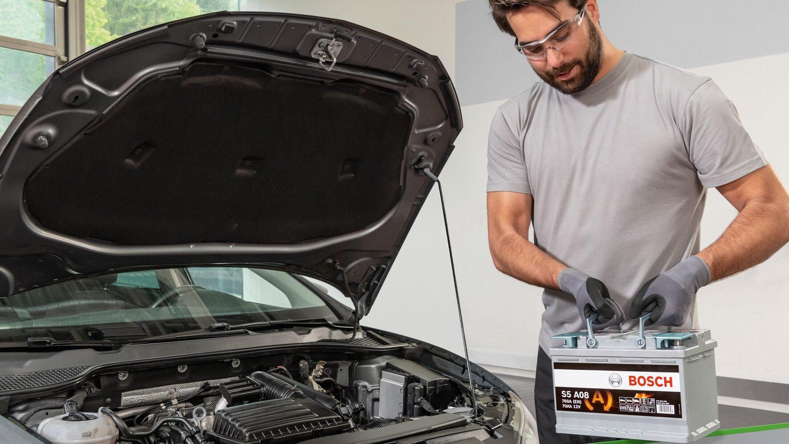 Bosch battery replacement service in Qatar by AAQATAR at roadside