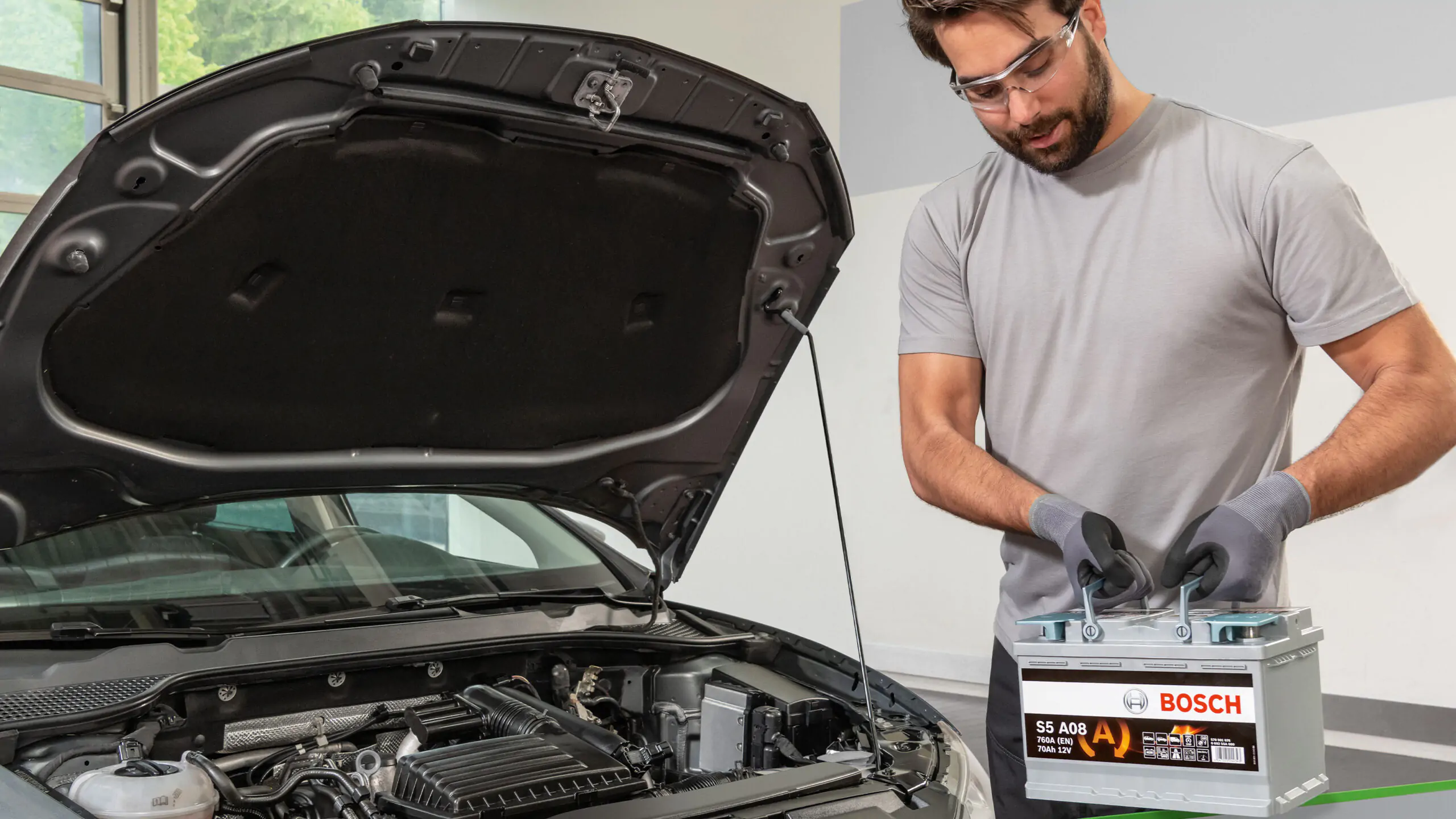 Bosch battery replacement service in Qatar by AAQATAR at roadside